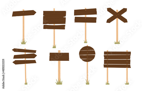 Wooden sign board and pointer in green grass Set. Vintage wood plank, sign or pointer collection. Vector illustration in cartoon style. Isolated on white background.