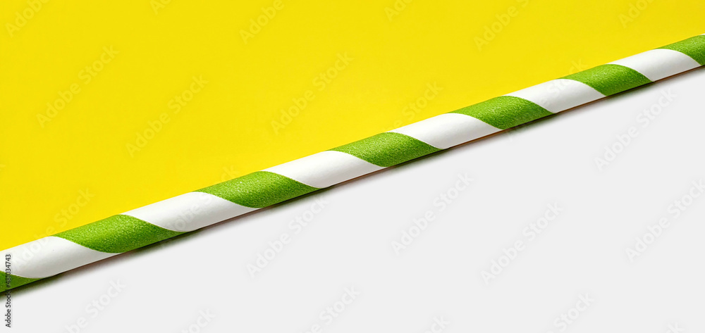 Paper straws for drinks on a yellow and white background. Bright spring background. Yellow-white summer background. Preparation for advertising and postcards. Frame for advertising and design. Paper straws for drinks on a yellow and white background. Bright spring background. Yellow-white summer background. Preparation for advertising and postcards. Frame for advertising and design.