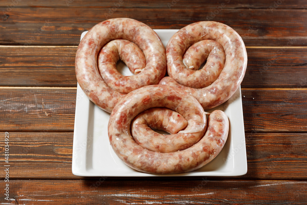 The chef made three long sausages.