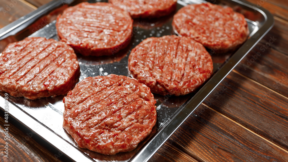 Six sausages are fried by the cook of the restaurant. Six sausages are fried by the cook of the restaurant.