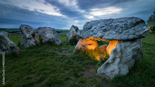 Tombstones in the sunset on a meadow photo