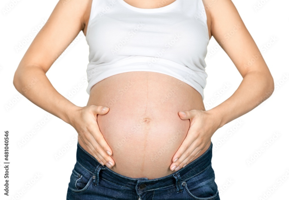 Beautiful pregnant woman holds her belly Beautiful pregnant woman holds her belly