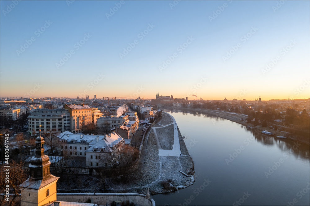 Krakow city center aerial view in Snowy winter. Sunset over Wawel castle from Nortbertine convent