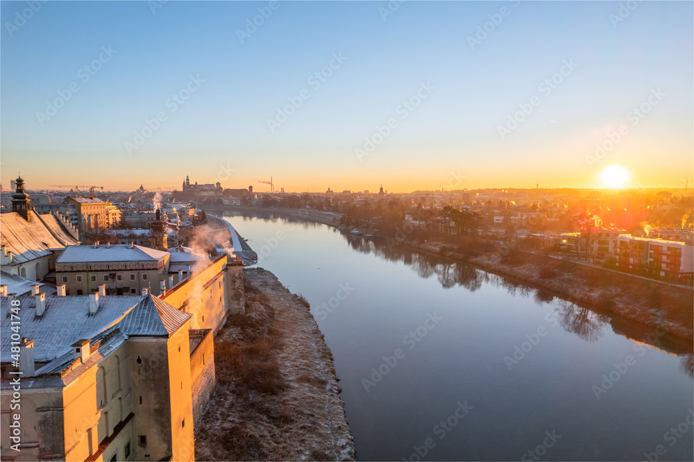 Krakow city center aerial view in Snowy winter. Sunset over Wawel castle from Nortbertine convent