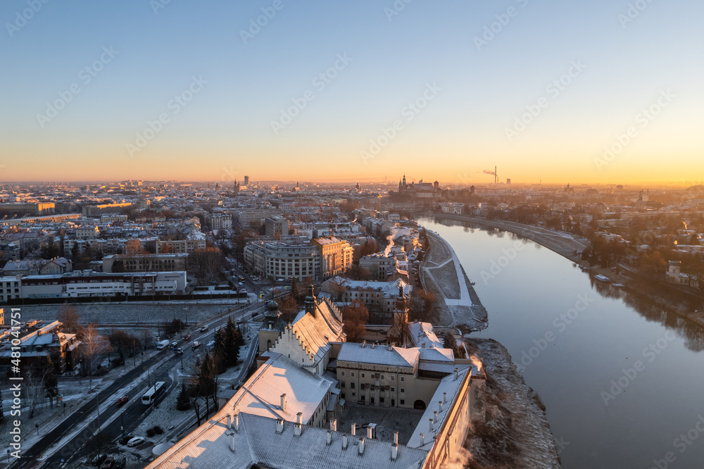 Krakow city center aerial view in Snowy winter. Sunset over Wawel castle from Nortbertine convent