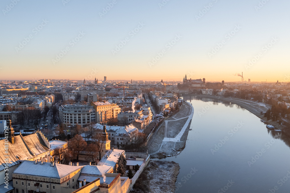 Krakow city center aerial view in Snowy winter. Sunset over Wawel castle from Nortbertine convent