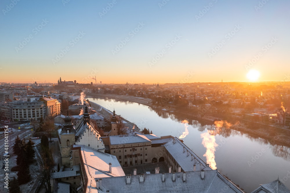 Krakow city center aerial view in Snowy winter. Sunset over Wawel castle from Nortbertine convent