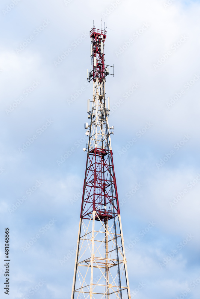 Metal communication tower with various antennas and surveillance cameras Metal communication tower with various antennas and surveillance cameras