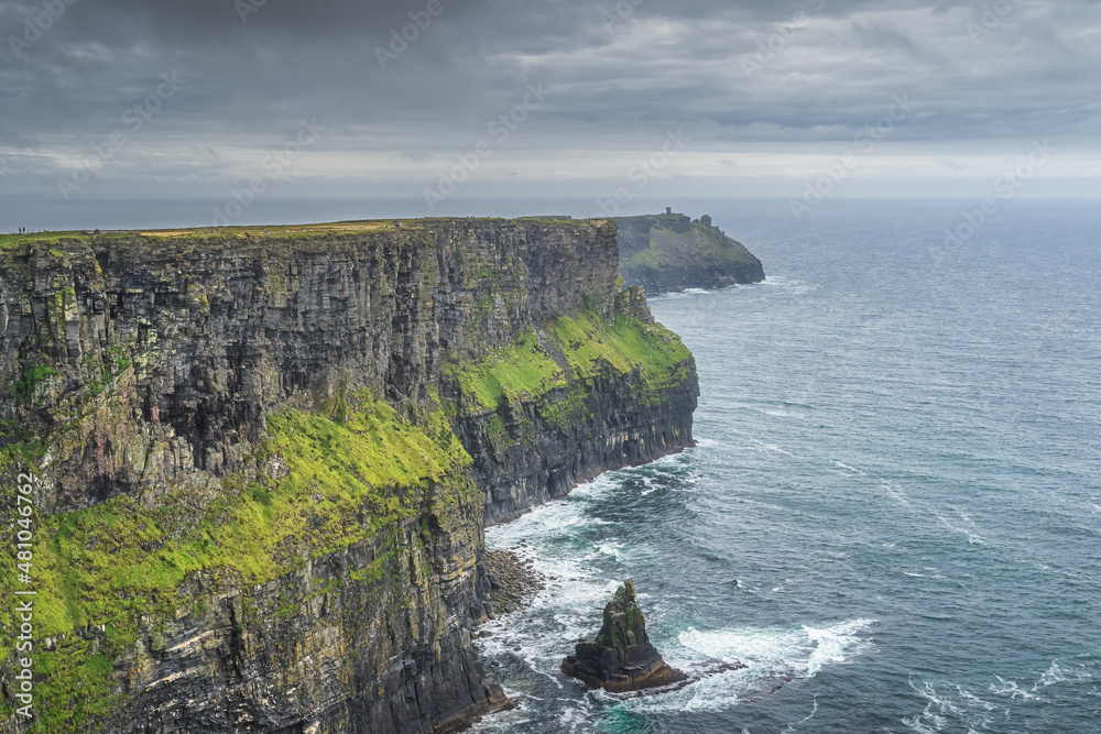Dramatic storm clouds over iconic Cliffs of Moher, popular tourist attraction, UNESCO, Wild Atlantic Way, Clare, Ireland