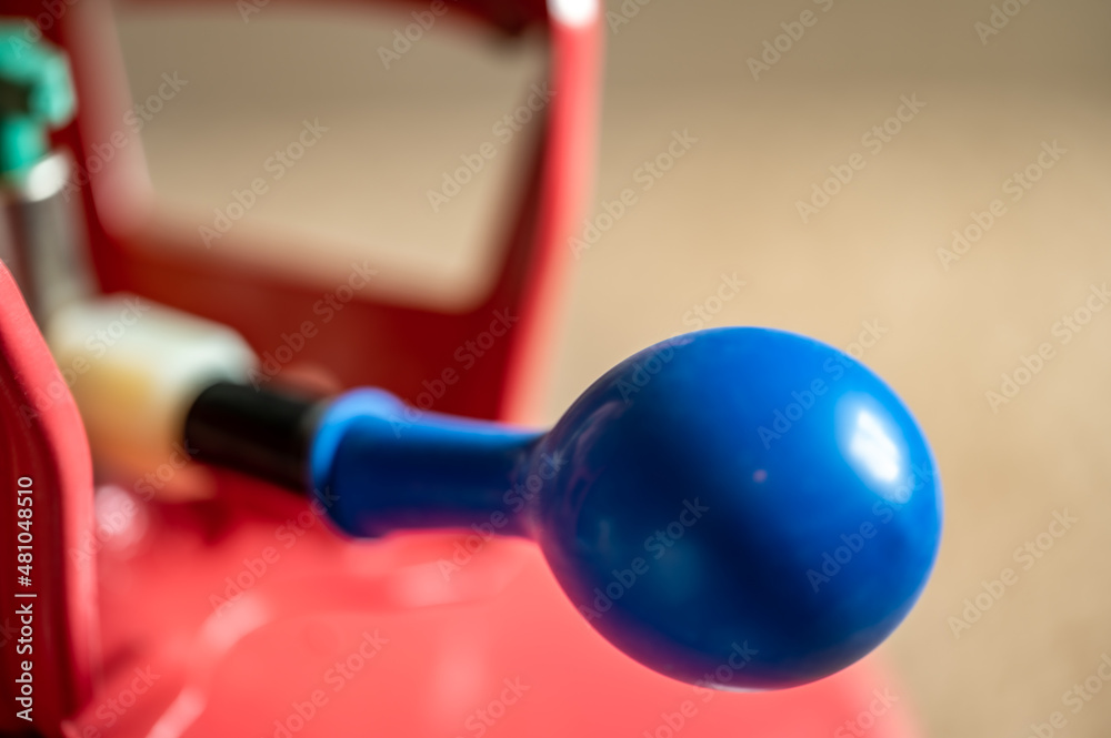 Selective focus on edge of an inflatable balloon attached to a helium canister. Selective focus on edge of an inflatable balloon attached to a helium canister.