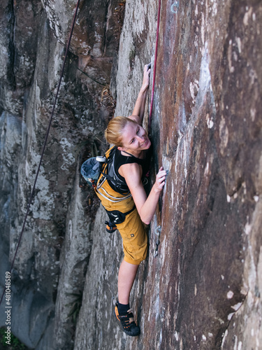 Blond Rock Climbing Girl in Top Rope in Tenerife Canarian Islands