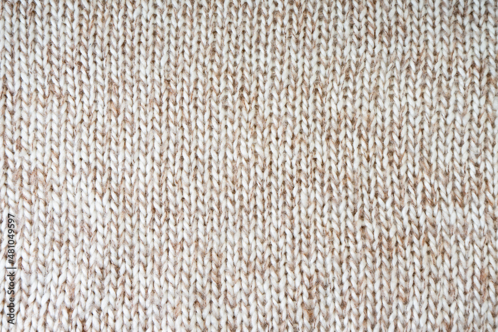 White biege mixed color knitting wool texture. Close up background. White biege mixed color knitting wool texture. Close up background.