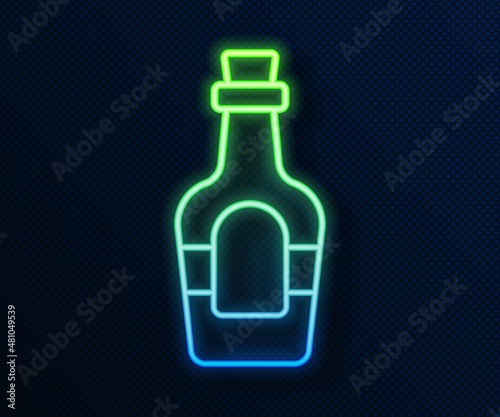 Glowing neon line Alcohol drink Rum bottle icon isolated on blue background. Vector