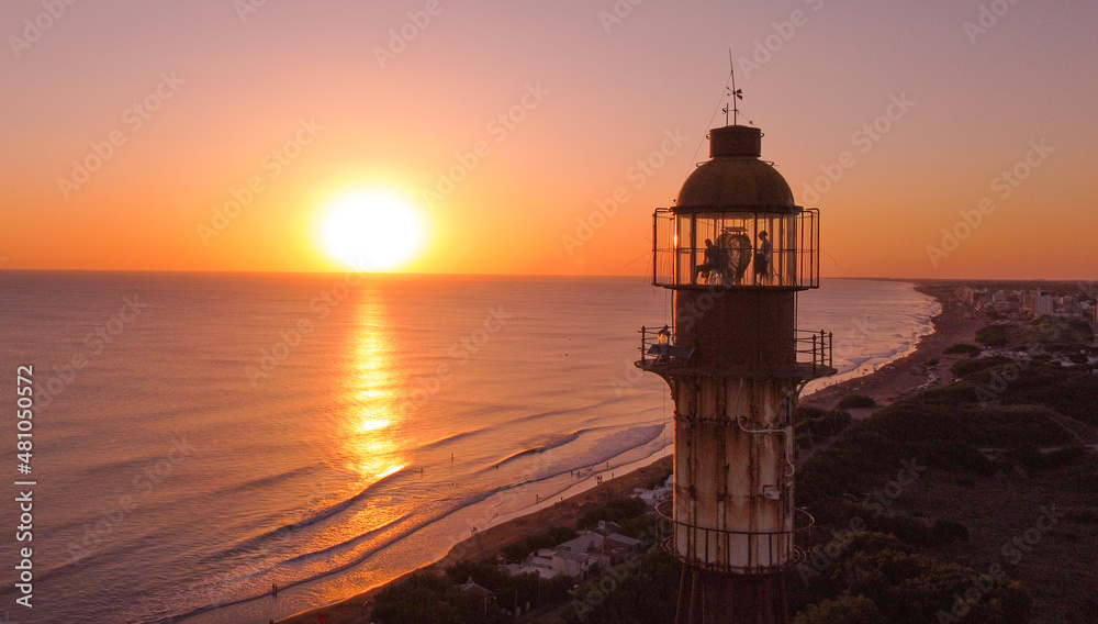 Aerial Picture Around A Light House With Beautiful Sunset Over Ocean