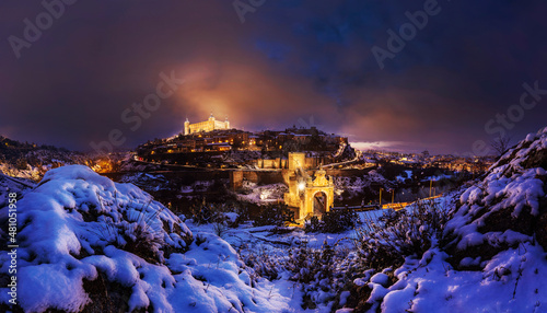 Lights of Toledo on after a winter snowstorm. photo