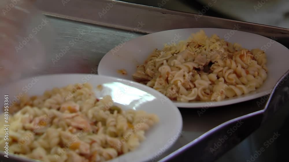 Bowls with Pasta during Lunch Time in a Public School of Buenos Aires, Argentina. Close Up. Bowls with Pasta during Lunch Time in a Public School of Buenos Aires, Argentina. Close Up.