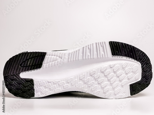 Running sport shoe's sole against white background.