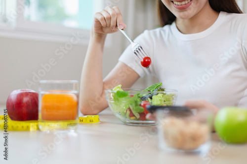 woman eating salad vegetables. female and healthy food diet.