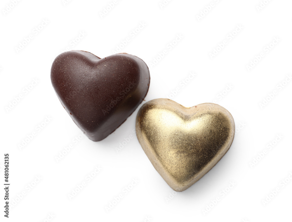 Tasty heart-shaped candies on white background Tasty heart-shaped candies on white background