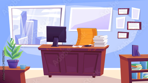 Office space. A desk with a stack of papers and a computer monitor.