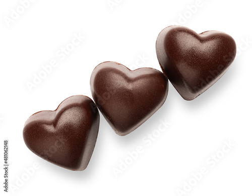 Tasty heart-shaped candies on white background