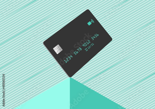A modern dark grey credit card is seen atop a pyramid with a striped light green background in this 3-d illustration. photo