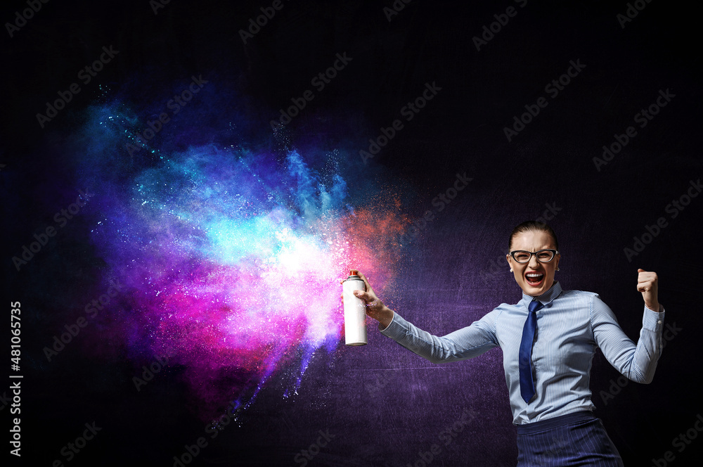 Businesswoman spraying paint . Mixed media Businesswoman spraying paint . Mixed media