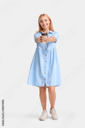 Smiling woman in a denim dr...