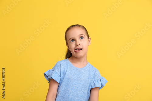 Funny little girl showing t...