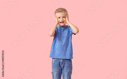 Surprised little boy in blu...