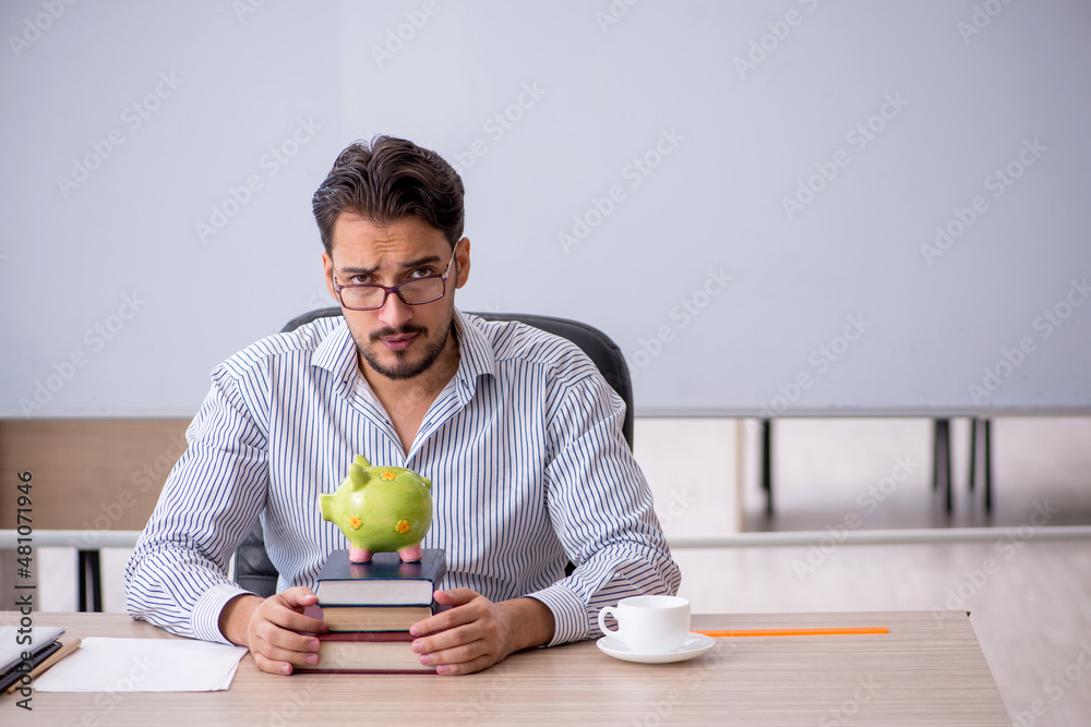 Fototapeta premium Young male teacher in retirement concept