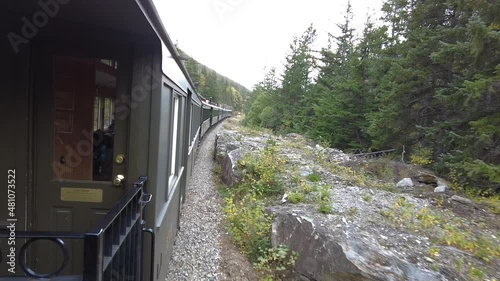 Pov train shot of during ride through wilderness of Alaska during daytime - Idyllic landscape on Mount Roberts Trail photo