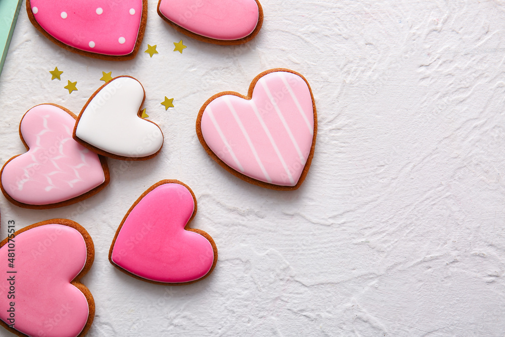Tasty heart shaped cookies on white background