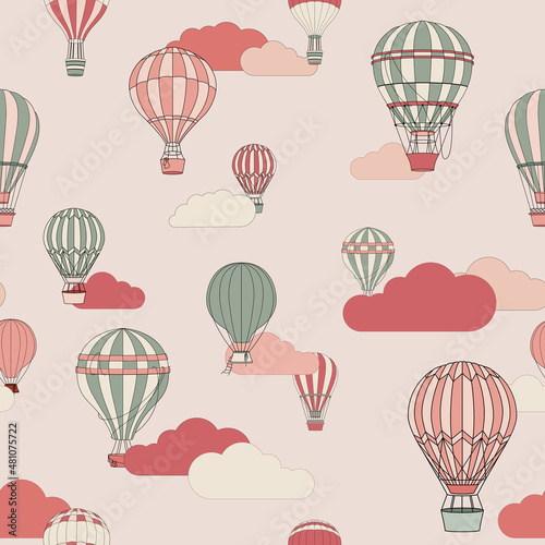 Seamless vector pattern with different air balloons and clouds in soft pink colors. Hand- drawn illustration for wallpaper in kids room, design fabric and textile, wrapping paper.
