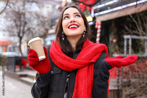 Happy woman with paper cup ...