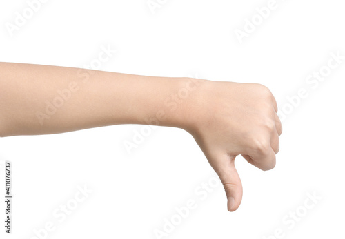 Child showing thumb-down on white background