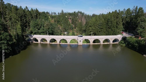 Stone dam with an arch bridge The dam of the Sedlice reservoir by Humpolec city, Vysocina region Czech republic Kamenná hráz s obloukovým mostem Hráz vodní nádrže Sedlice aerial scenic panorama view
 photo