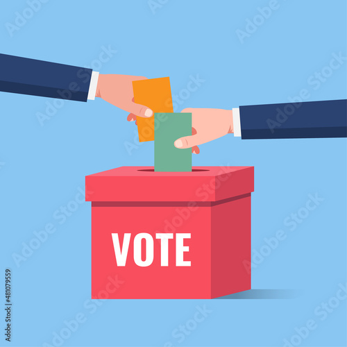 Voting and election, hand holding the ballot paper into the ballot box