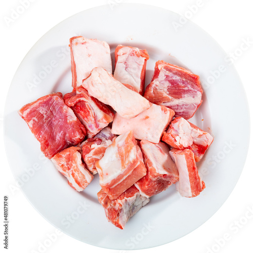 Unprepared pork ribs chopped and ready-to-cook. Meat dish ingredient. Isolated over white background