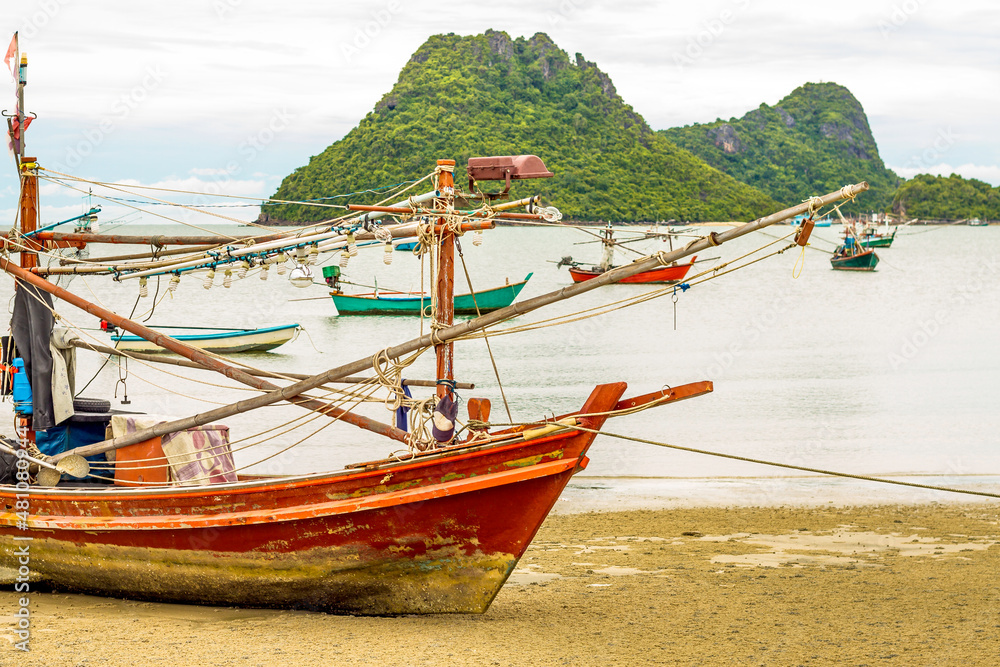 Fishing boat on the beach. Fishermen is a career that has been popular in the seaside city of Thailand.