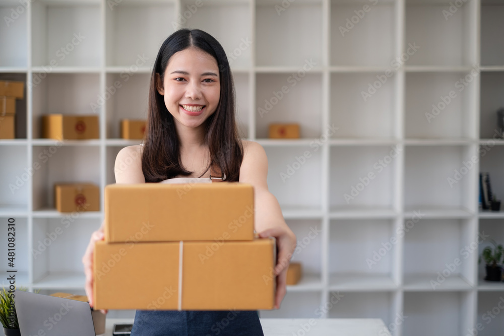 Business owner excite when got an order from her online shop. Successful SME entrepreneur concept.