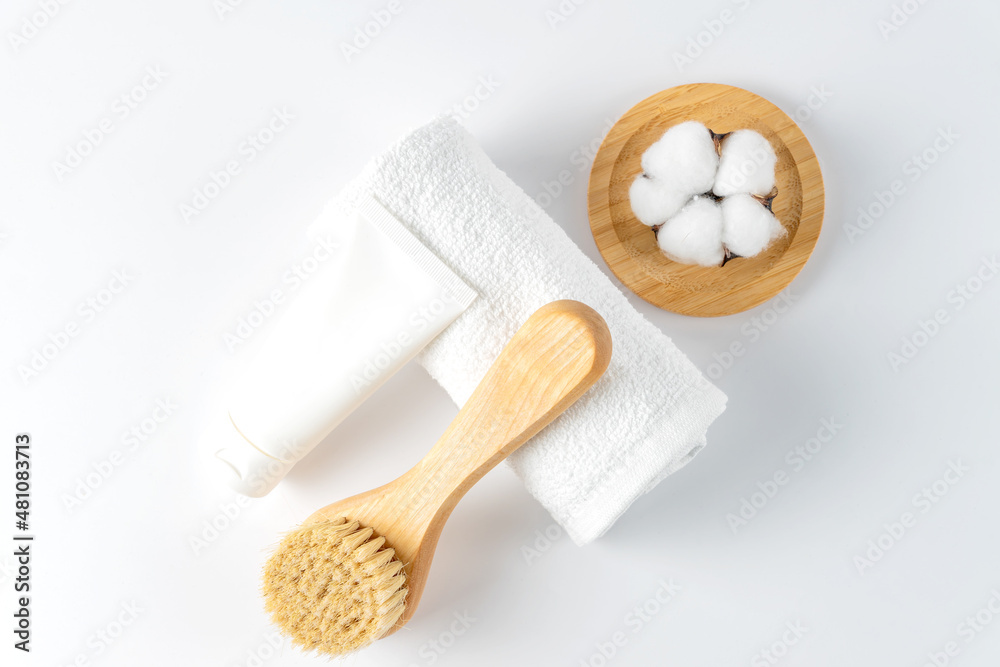 natural bristle massage brush for body brushing, towel and body scrub on white background. natural bristle for removing of cellulite and stimulating lymphatic system. Tools for spa natural bristle massage brush for body brushing, towel and body scrub on white background. natural bristle for removing of cellulite and stimulating lymphatic system. Tools for spa