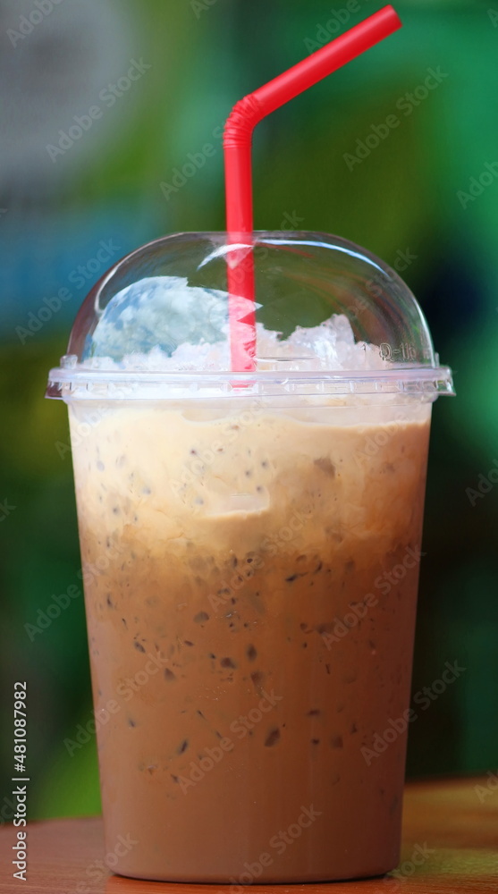 Antique coffee in a clear plastic cup. Antique coffee in a clear plastic cup.