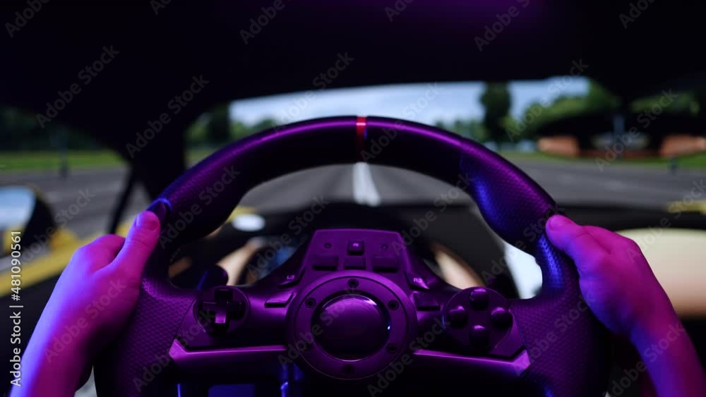 Little boy driving online racing simulator game on pc computer. Child using play station game with steering wheel. Kid playing car simulator on a video controller at home, learning to drive concept