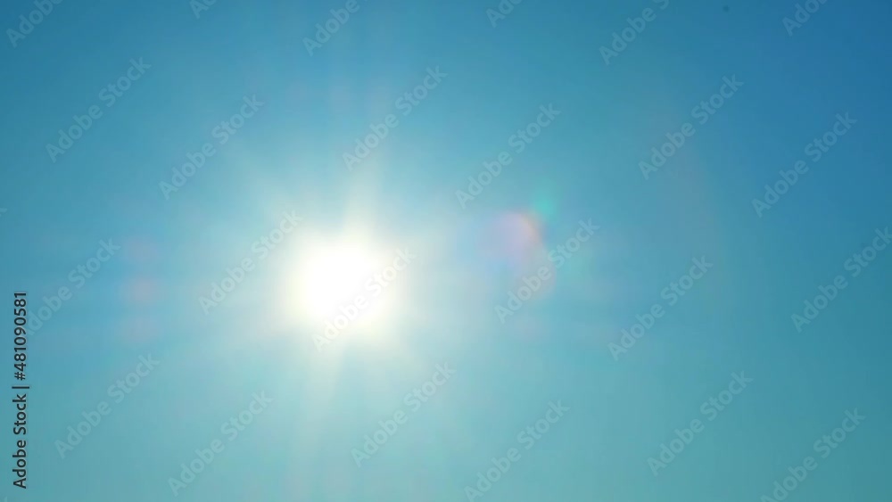 Time-lapse photography of sun rising on a blue sky Time-lapse photography of sun rising on a blue sky