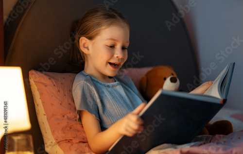 girl is reading a book photo