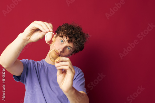 portrait of a young curly man posing emotions close-up isolated background