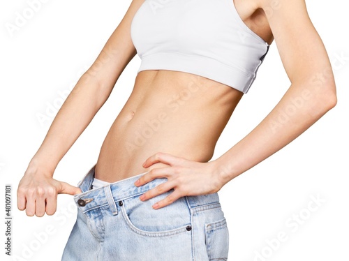 Slim young woman showing big pants