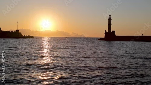 Magical sunset behind the lighthouse in Chania, Crete island, Greece