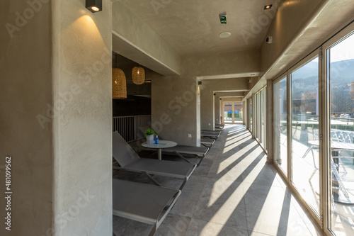 Sunbeds in glazed terrace in hotel wellness © rilueda
